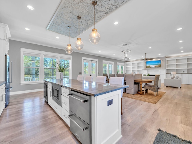 61 Sweet Breeze Dr, Santa Rosa Beach, FL 32459 - kitchen featuring plenty of natural light, white cabinets, recessed lighting, a center island, and pendant lighting
