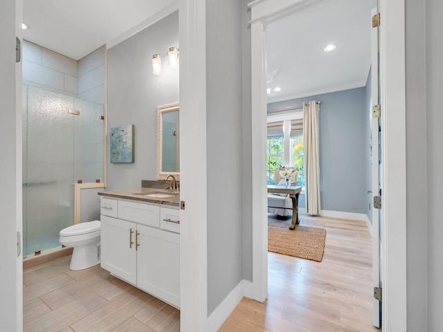 61 Sweet Breeze Dr, Santa Rosa Beach, FL 32459 - full bathroom with a shower stall, wood finished floors, vanity, recessed lighting, and toilet