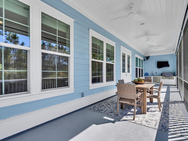 61 Sweet Breeze Dr, Santa Rosa Beach, FL 32459 - view of patio featuring outdoor dining space, a ceiling fan, area for grilling, a sink, and a porch