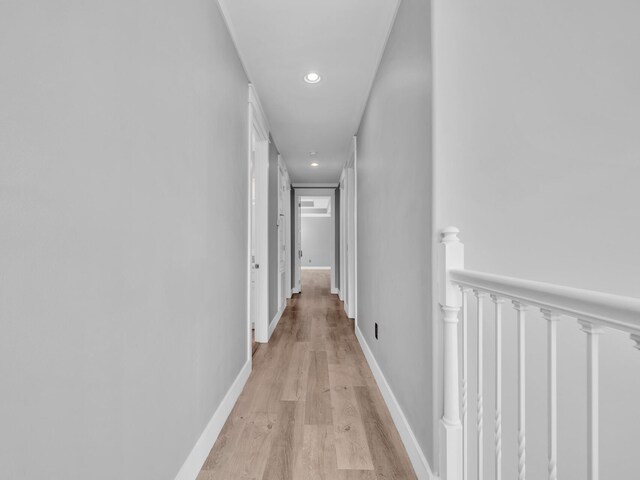 61 Sweet Breeze Dr, Santa Rosa Beach, FL 32459 - corridor featuring an upstairs landing, light wood-style floors, recessed lighting, and baseboards