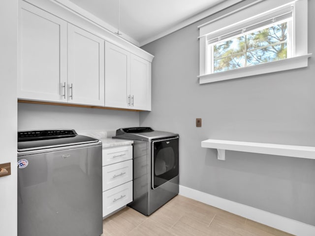 61 Sweet Breeze Dr, Santa Rosa Beach, FL 32459 - laundry area with washing machine and clothes dryer, cabinet space, and baseboards
