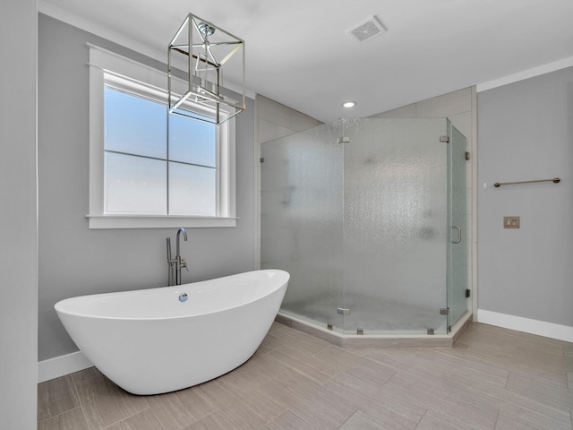 61 Sweet Breeze Dr, Santa Rosa Beach, FL 32459 - bathroom with a freestanding bath, baseboards, and a shower stall