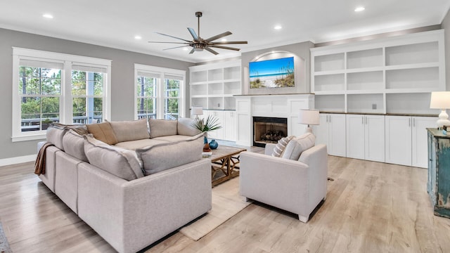 61 Sweet Breeze Dr, Santa Rosa Beach, FL 32459 - living room with a ceiling fan, light wood-type flooring, a fireplace, baseboards, and recessed lighting