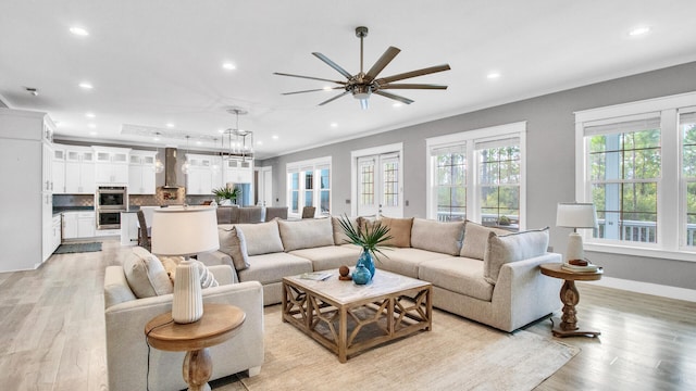 61 Sweet Breeze Dr, Santa Rosa Beach, FL 32459 - living room with recessed lighting, light wood-style floors, a ceiling fan, baseboards, and crown molding
