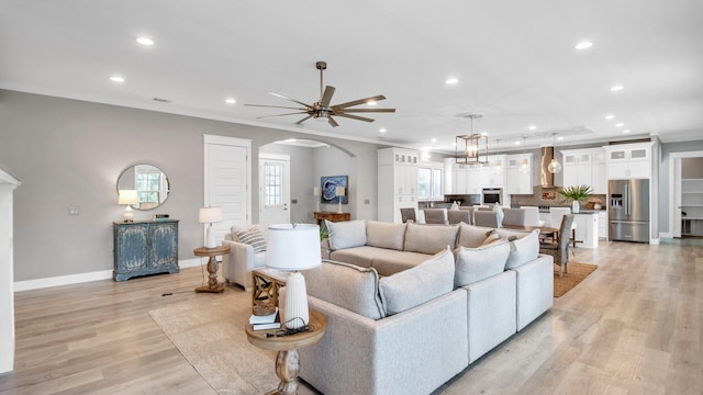 61 Sweet Breeze Dr, Santa Rosa Beach, FL 32459 - living area featuring arched walkways, recessed lighting, baseboards, ceiling fan, and light wood-type flooring