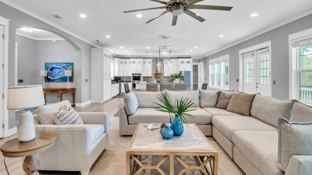 61 Sweet Breeze Dr, Santa Rosa Beach, FL 32459 - living area featuring recessed lighting, arched walkways, healthy amount of natural light, a ceiling fan, and crown molding