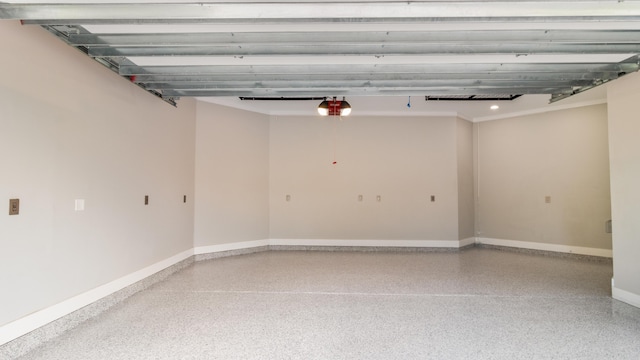 61 Sweet Breeze Dr, Santa Rosa Beach, FL 32459 - garage featuring baseboards and a garage door opener