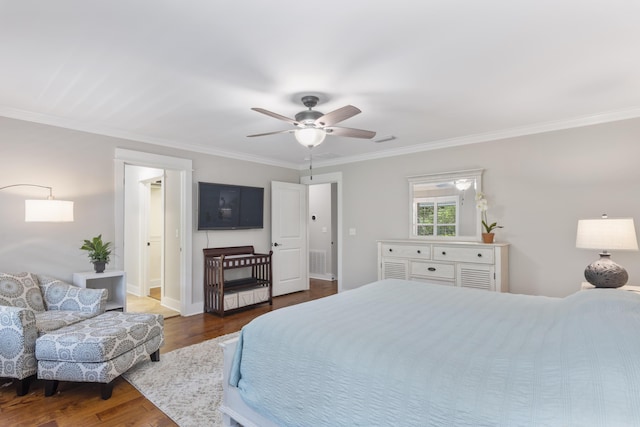 bedroom with crown molding, ceiling fan, and dark hardwood / wood-style flooring