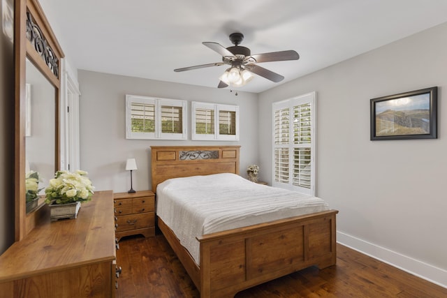 bedroom with ceiling fan and dark hardwood / wood-style floors