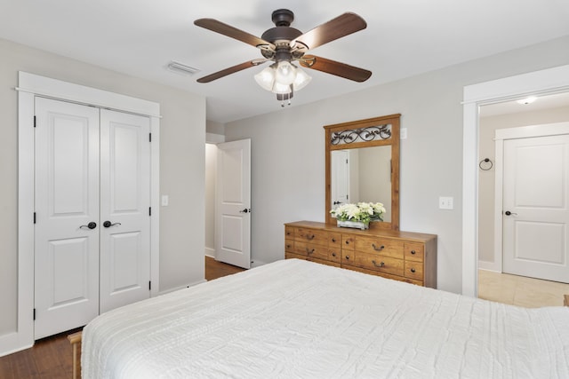 bedroom with ceiling fan and a closet