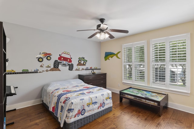 bedroom with ceiling fan and dark hardwood / wood-style flooring