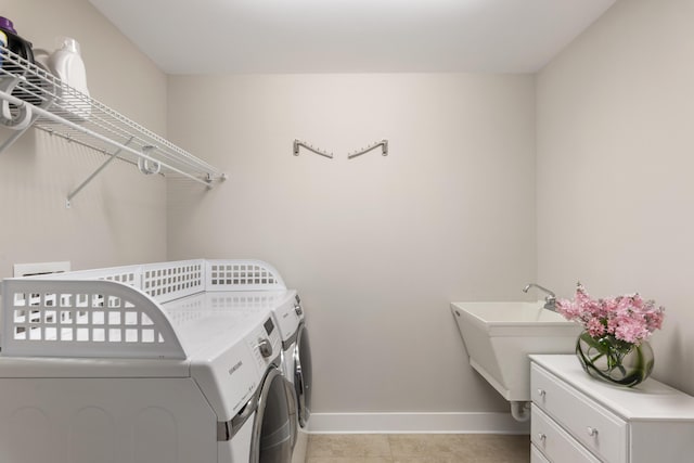 clothes washing area featuring washer and dryer