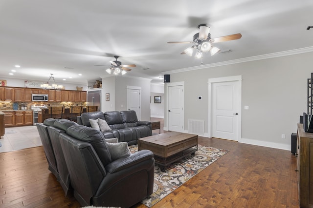 living room with crown molding, ceiling fan with notable chandelier, and light hardwood / wood-style floors