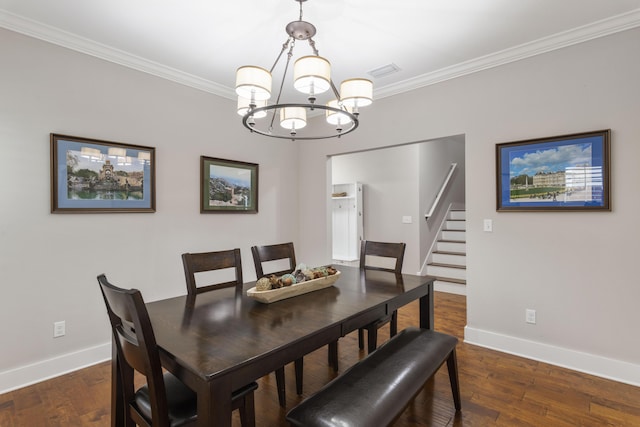 dining space featuring crown molding, dark wood-type flooring, and an inviting chandelier