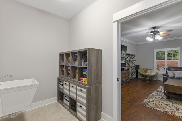 interior space featuring crown molding, sink, hardwood / wood-style floors, and ceiling fan