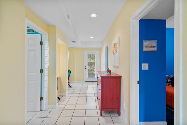 hallway with light tile patterned floors