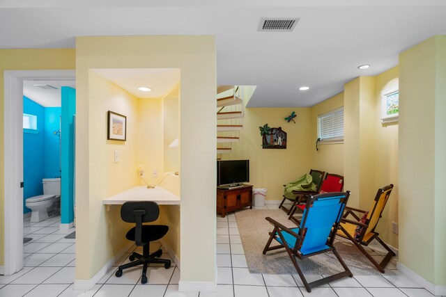 sitting room with light tile patterned floors