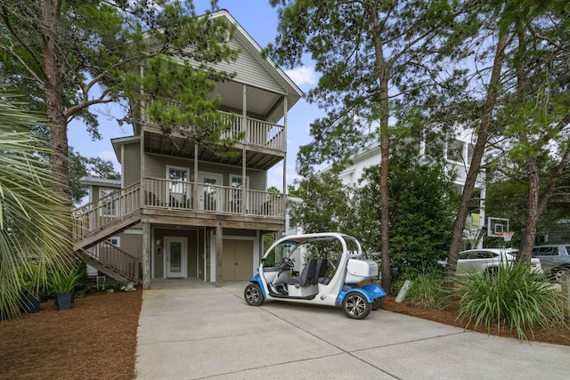 view of front of house featuring a balcony and a garage