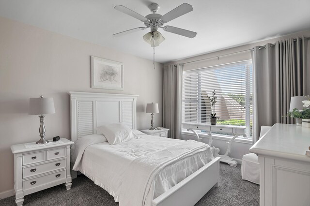 bedroom with dark carpet and ceiling fan