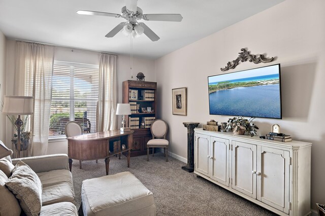 living room with light carpet and ceiling fan