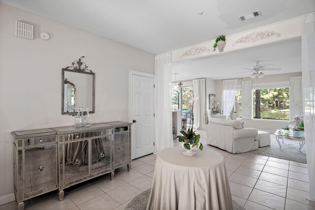 dining space with light tile patterned floors and ceiling fan