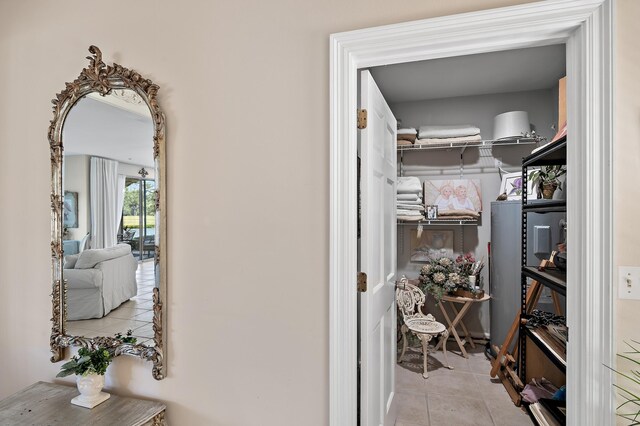 spacious closet with light tile patterned floors