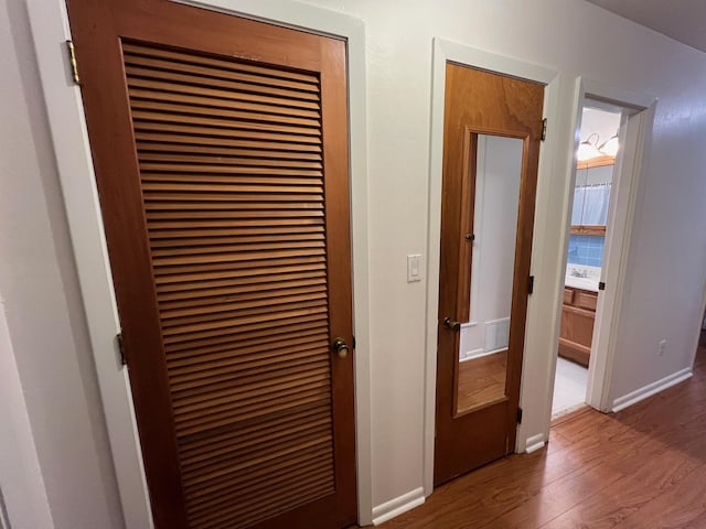 hall with dark hardwood / wood-style floors