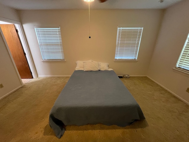 bedroom featuring light colored carpet