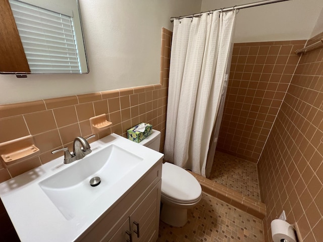 bathroom featuring tile walls, tile patterned flooring, vanity, toilet, and a shower with curtain