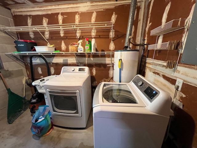 clothes washing area with water heater and separate washer and dryer