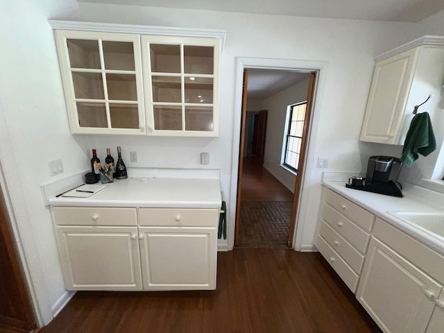 kitchen with white cabinetry and dark hardwood / wood-style flooring