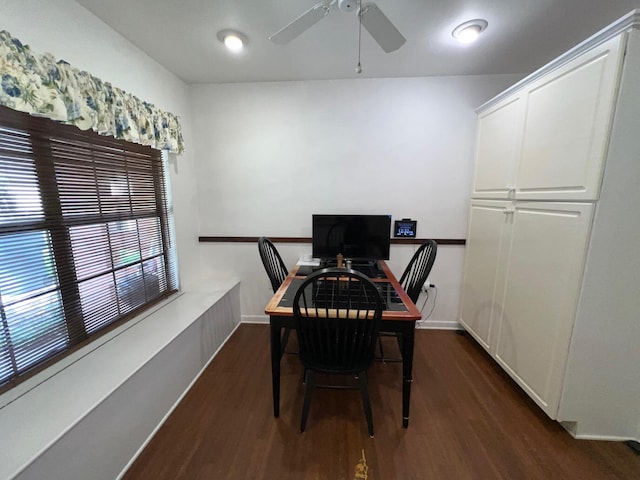 dining space with dark wood-type flooring and ceiling fan