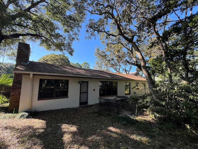 back of house with a patio