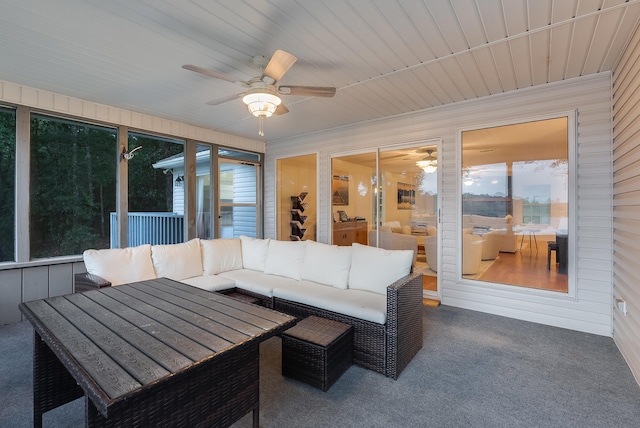 sunroom with a wealth of natural light and ceiling fan