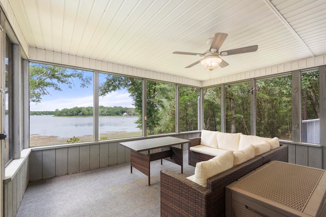 sunroom / solarium featuring plenty of natural light, a water view, wooden ceiling, and ceiling fan