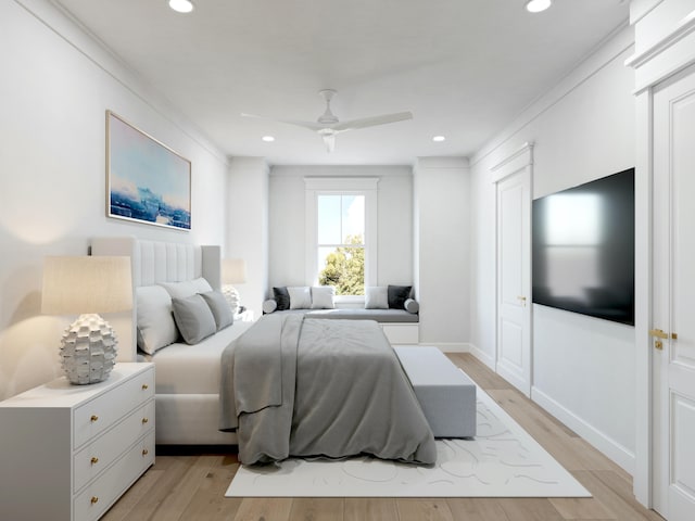 bedroom featuring light hardwood / wood-style flooring, ornamental molding, and ceiling fan