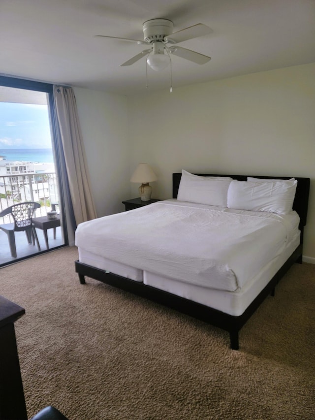 bedroom featuring carpet flooring, access to exterior, and ceiling fan