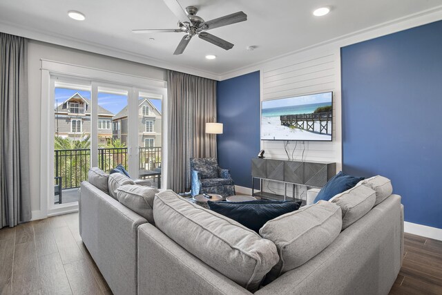 living room with ceiling fan, plenty of natural light, hardwood / wood-style floors, and ornamental molding