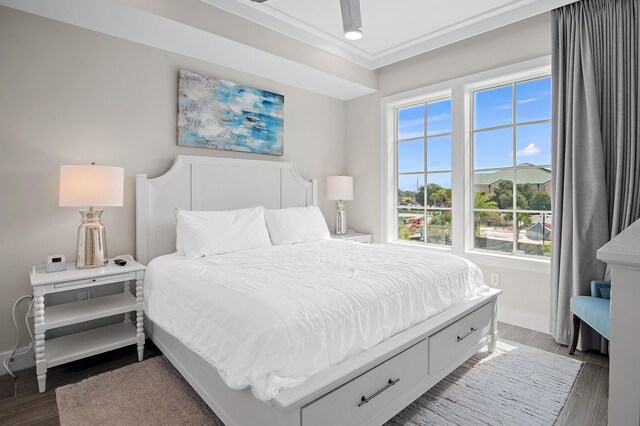 bedroom with hardwood / wood-style flooring and ceiling fan