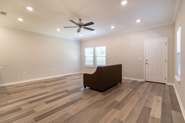 unfurnished room with ceiling fan, hardwood / wood-style floors, and crown molding