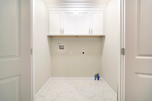 clothes washing area with hookup for an electric dryer, cabinets, and hookup for a washing machine