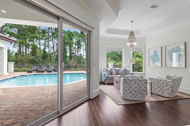 view of pool featuring an inviting chandelier