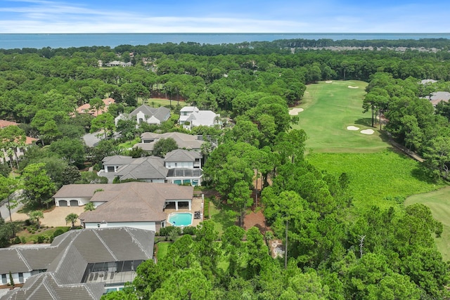 bird's eye view with a forest view and a water view