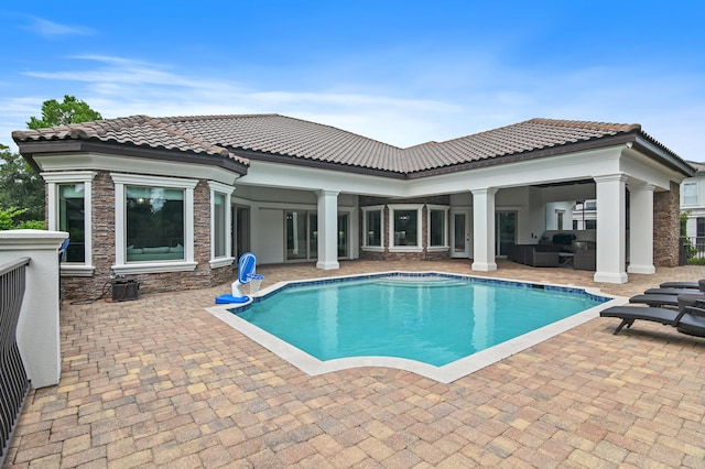 view of swimming pool with a patio