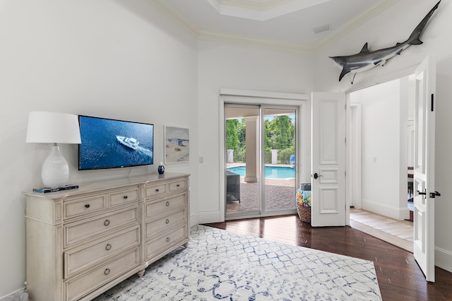 bedroom featuring access to outside, baseboards, crown molding, and hardwood / wood-style floors