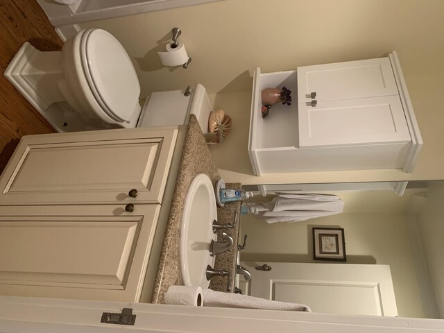 bathroom featuring vanity and toilet