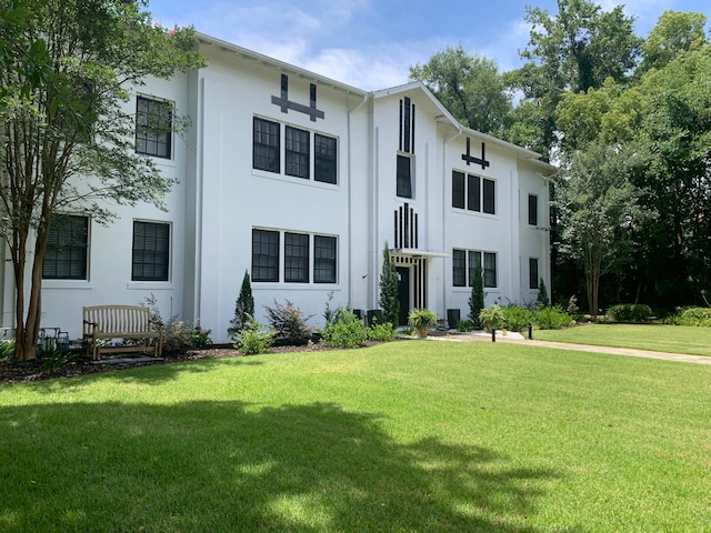 rear view of property with a yard