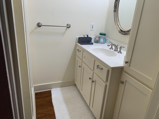 bathroom featuring vanity and wood-type flooring