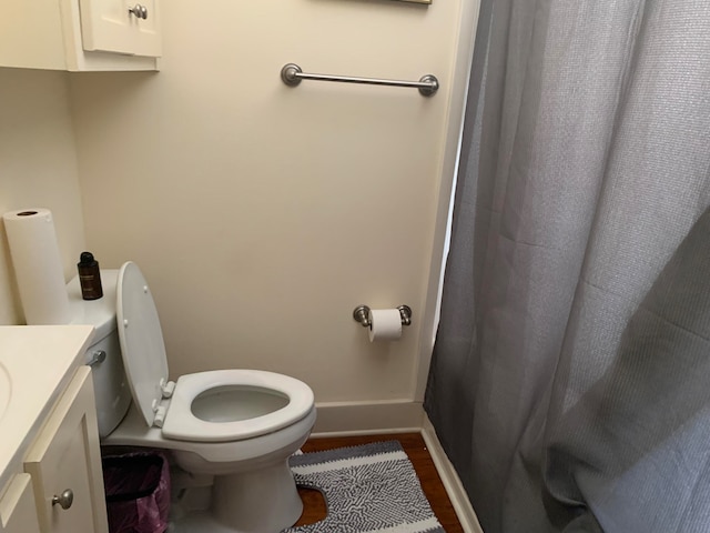 bathroom featuring hardwood / wood-style floors, toilet, and vanity