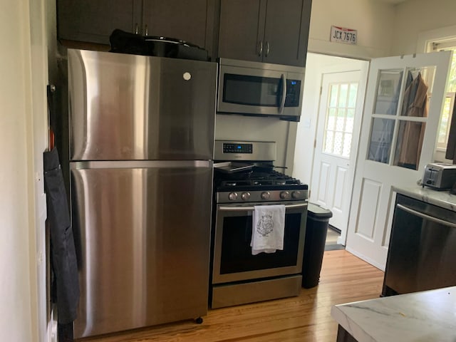 kitchen featuring appliances with stainless steel finishes and light wood-type flooring